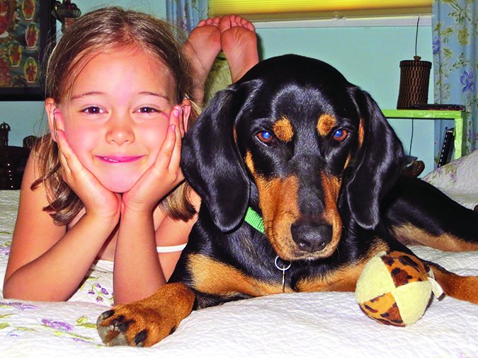 girl and coonhound