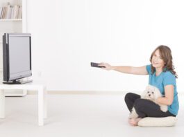 Drug Ads for Veterinary Products woman watching tv with dog