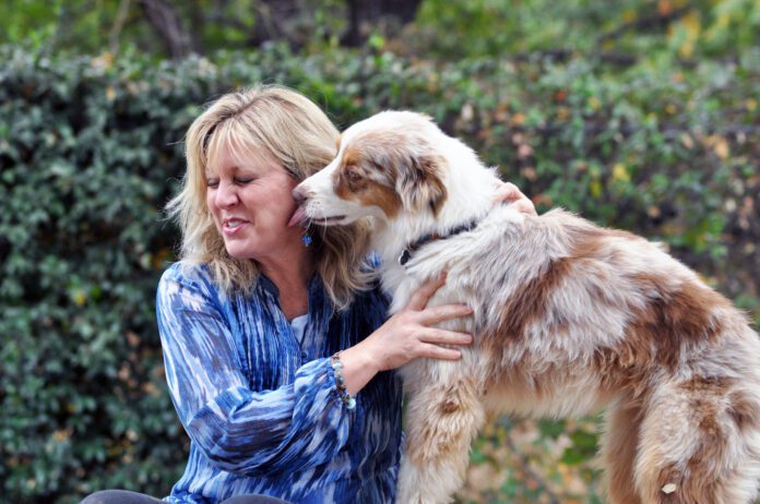 dog licking person's face