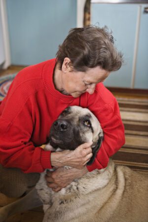 senior woman with large dog