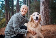 Shot of a senior woman out for a hike with her dog