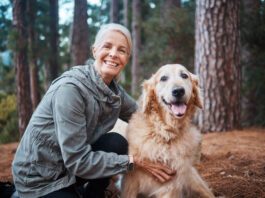 Shot of a senior woman out for a hike with her dog