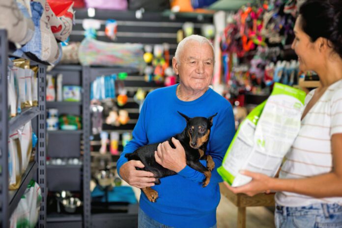 Pet store employee helps an elderly man choose dog food Many brands claim to be natural dog food, but how can you know if you're getting the best dog food.